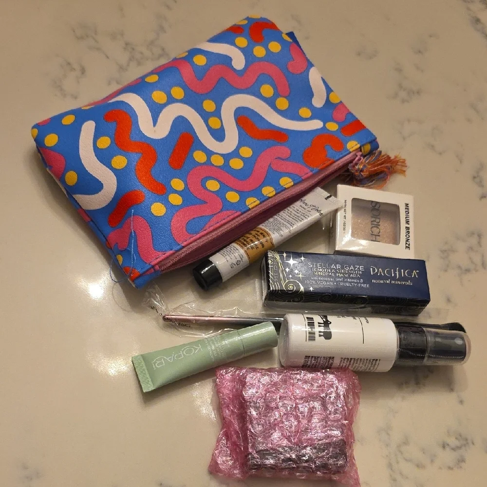 Colorful Patterned Makeup Bag with Assorted Beauty Products